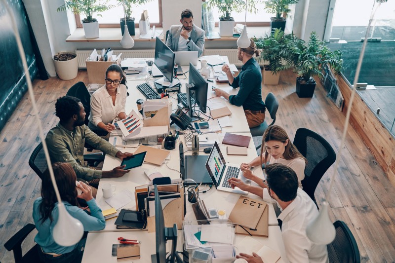 Employees collaborating in a healthy workplace environment